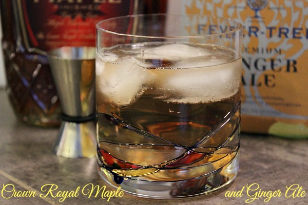 Crown Royal Maple in cocktail glass, garnished with cherry and cucumber