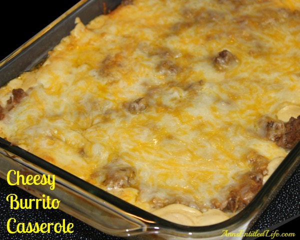 yellow cheese burrito casserole in a serving dish