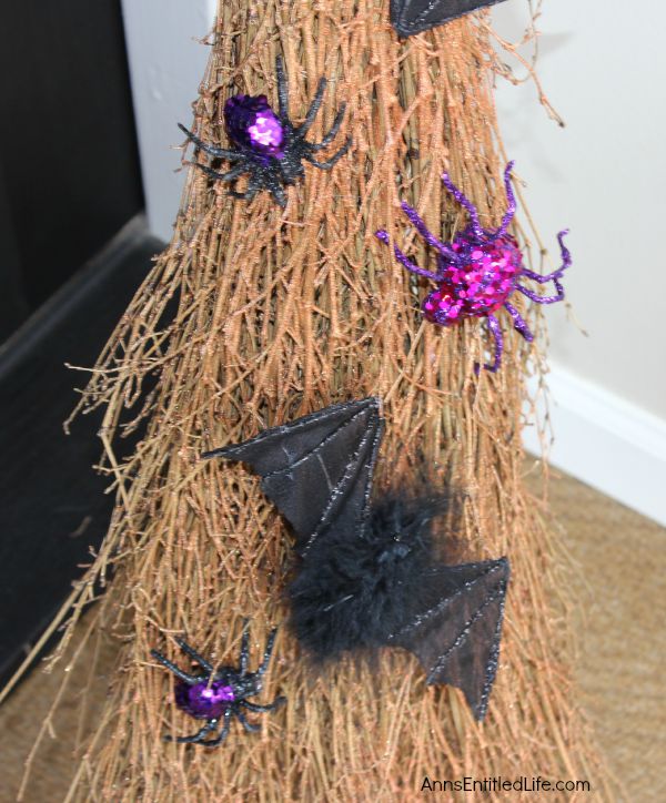 Easy DIY Halloween Glitter Witch’s Broomstick; simple and fun to make Halloween Witch's Glitter Broomstick Tutorial DIY project. With just an hour of your time, and you have a wonderful 6 foot tall witch broomstick to make your Halloween decor, or costume, complete!