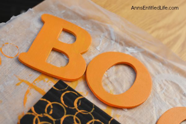 DIY Boo Pallet Project; An easy to make Halloween decoration. Easily, quickly, and inexpensively make this cute Boo Pallet to add to your Halloween mantel display, hang on a door, or prop on a frame on a table.  These simple step by step instructions make this DIY Boo Pallet Project effortless.