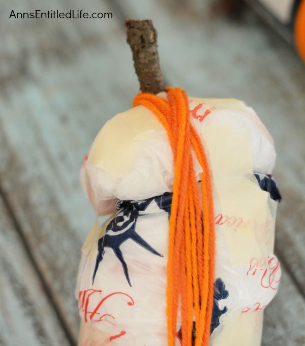 Easy DIY No-Sew Yarn Pumpkins; these No-Sew Yarn Wrapped Pumpkins are super easy to make, require no special crafting skills and are totally adorable. If you need a quick fall craft, or would like a (supervised) project for your children on a rainy weekend, these pumpkins are a terrific craft project.