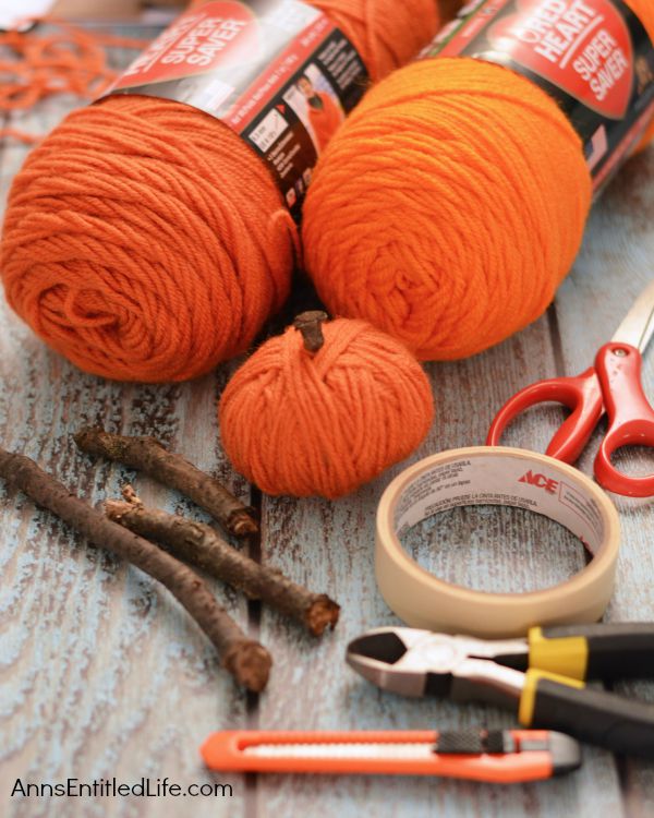 Easy DIY No-Sew Yarn Pumpkins; these No-Sew Yarn Wrapped Pumpkins are super easy to make, require no special crafting skills and are totally adorable. If you need a quick fall craft, or would like a (supervised) project for your children on a rainy weekend, these pumpkins are a terrific craft project.