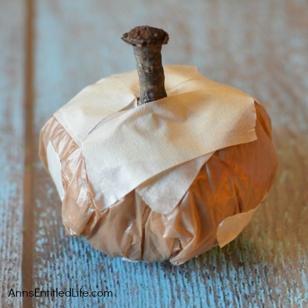 Easy DIY No-Sew Yarn Pumpkins; these No-Sew Yarn Wrapped Pumpkins are super easy to make, require no special crafting skills and are totally adorable. If you need a quick fall craft, or would like a (supervised) project for your children on a rainy weekend, these pumpkins are a terrific craft project.