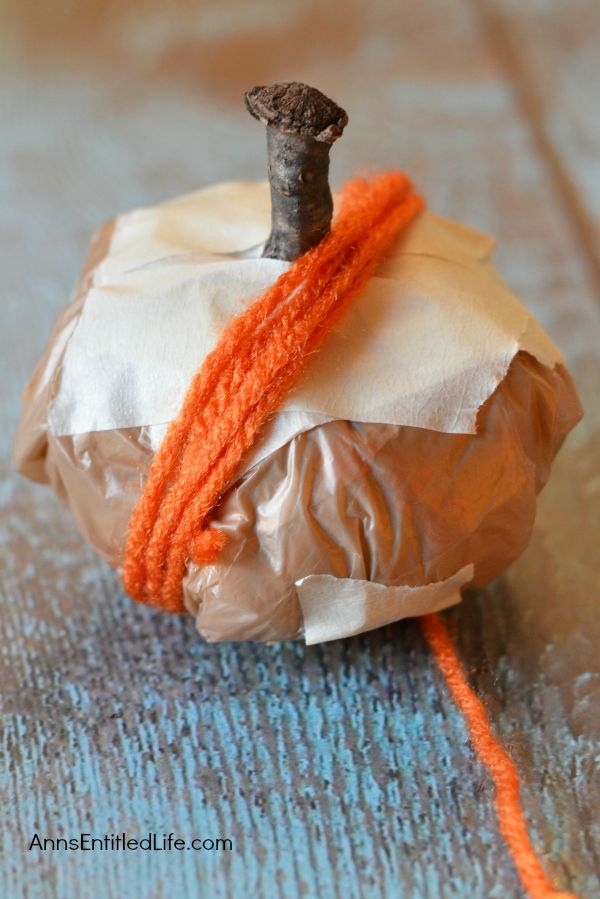 Easy DIY No-Sew Yarn Pumpkins; these No-Sew Yarn Wrapped Pumpkins are super easy to make, require no special crafting skills and are totally adorable. If you need a quick fall craft, or would like a (supervised) project for your children on a rainy weekend, these pumpkins are a terrific craft project.