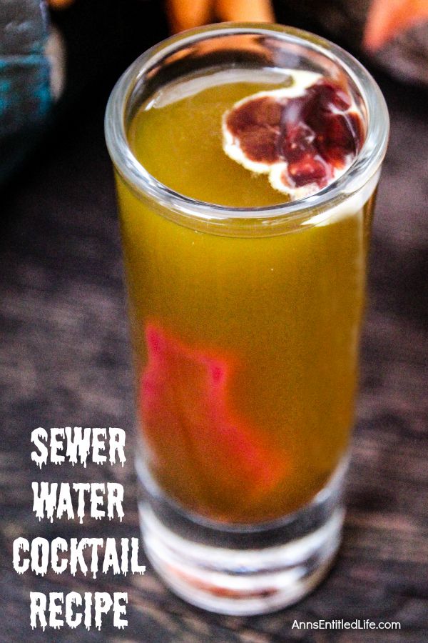 Sewer Water Cocktail Recipe; this murky mixture looks like sewer water, but tastes divine. At first glance your guests might be slightly hesitant to try this delightfully disgusting drink, but once they taste this Sewer Water Cocktail, they'll ask for it all night..