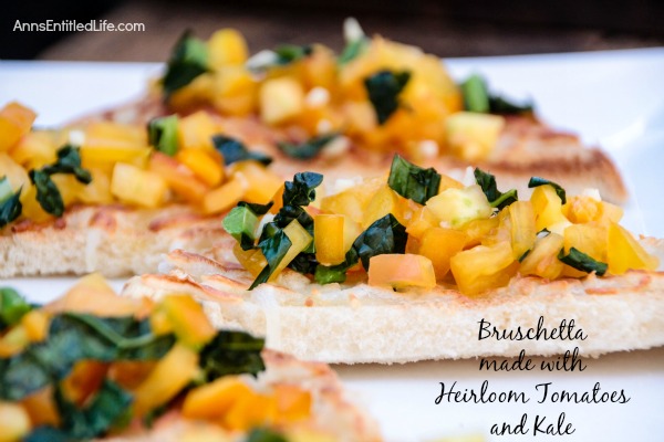 Bruschetta made with Heirloom Tomatoes and Kale; a delicious, easy to make Bruschetta recipe featuring delicious and sweet heirloom tomatoes, and tasty kale. This very versatile  Bruschetta made with Heirloom Tomatoes and Kale is a perfect accompaniment with any meal, a before meal appetizer, or simply as a stand alone snack.