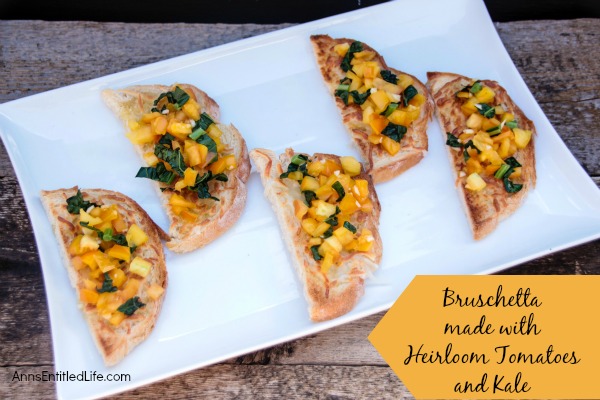 Bruschetta made with Heirloom Tomatoes and Kale; a delicious, easy to make Bruschetta recipe featuring delicious and sweet heirloom tomatoes, and tasty kale. This very versatile  Bruschetta made with Heirloom Tomatoes and Kale is a perfect accompaniment with any meal, a before meal appetizer, or simply as a stand alone snack.