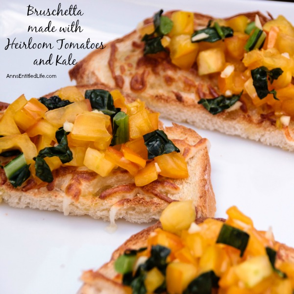 Bruschetta made with Heirloom Tomatoes and Kale; a delicious, easy to make Bruschetta recipe featuring delicious and sweet heirloom tomatoes, and tasty kale. This very versatile  Bruschetta made with Heirloom Tomatoes and Kale is a perfect accompaniment with any meal, a before meal appetizer, or simply as a stand alone snack.