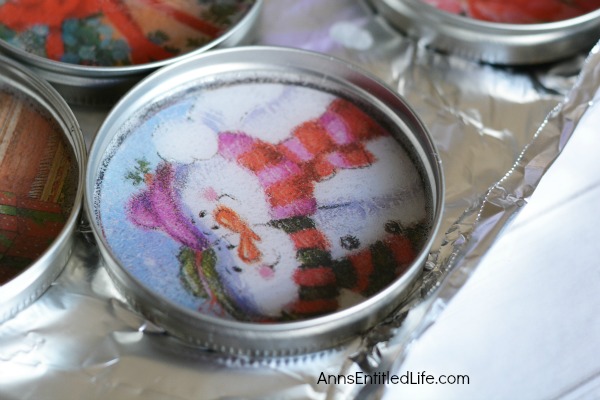 DIY Christmas Coasters. These DIY Christmas Coasters are cute and quite simple to make. This is a fantastic project to reuse old Christmas cards and to make a wonderful homemade gift for friends and family. These easy to make Christmas Coasters are unique, but usable. Plan ahead though because they do take time to cure.