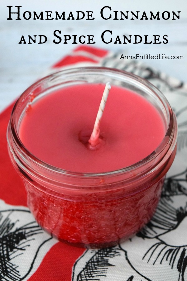 A red, sparkly, candle in a half pint mason jar.