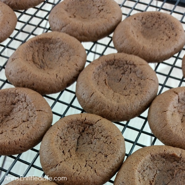 Chocolate Caramel Thumbprint Cookies Recipe. If you like thumbprint cookies, you will love this delicious update to that old classic recipe. These chocolate caramel thumbprint cookies combine the rich taste of chocolate with the smooth taste of caramel for a truly decadent cookie!