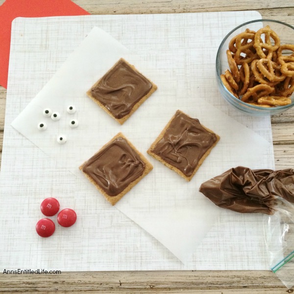 Reindeer Grahams Cookie Recipe. A super simple cookie recipe you can make with your children or grandchildren. These Reindeer Grahams are an adorable, tasty and just plain fun holiday treat!