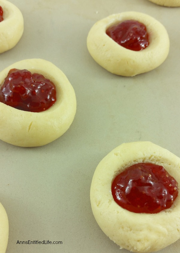 Thumbprint Cookies Recipe. A classic holiday cookie recipe, these Thumbprint cookies are easy to make. Buttery rich, jam sweet, these classic thumbprint cookies are melt in your mouth delicious.