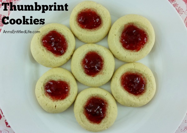 Thumbprint Cookies Recipe. A classic holiday cookie recipe, these Thumbprint cookies are easy to make. Buttery rich, jam sweet, these classic thumbprint cookies are melt in your mouth delicious.