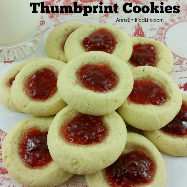 Thumbprint Cookies Recipe. A classic holiday cookie recipe, these Thumbprint cookies are easy to make. Buttery rich, jam sweet, these classic thumbprint cookies are melt in your mouth delicious.