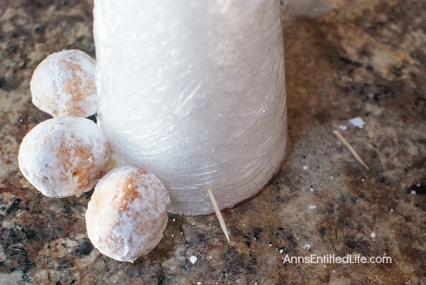 Donut Hole Tree. Make an adorable Donut Hole Tree for your next holiday party, Christmas breakfast, or other special occasion. This donut hole tree can be made all year, but is especially festive during the holiday season!