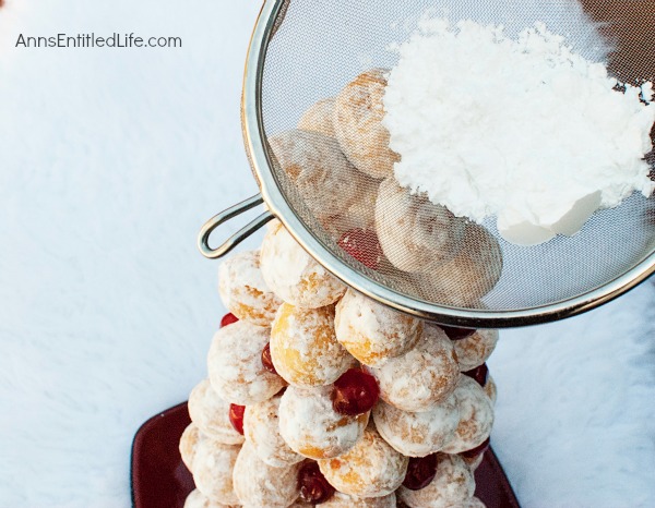 Donut Hole Tree. Make an adorable Donut Hole Tree for your next holiday party, Christmas breakfast, or other special occasion. This donut hole tree can be made all year, but is especially festive during the holiday season!