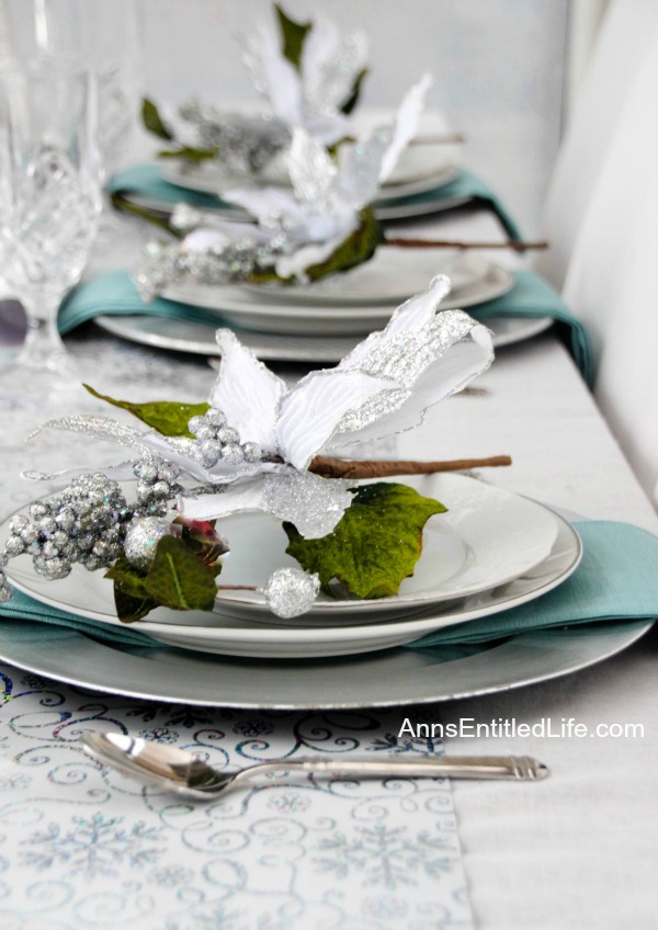 Winter Holiday Tablescape: White, Silver and Blue. Hosting a holiday party? Dressing up the table for Christmas, New Year's or just because? Break away from the traditional green and red Christmas colors and try something entirely different. This beautiful winter holiday tablescape features white, silver and blue. A lovely cool theme to compliment the winter landscape. 