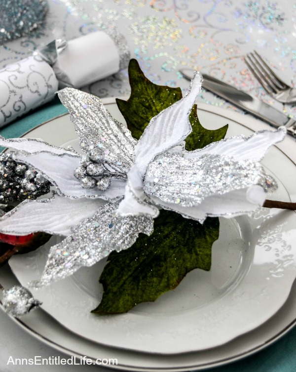 Winter Holiday Tablescape: White, Silver and Blue. Hosting a holiday party? Dressing up the table for Christmas, New Year's or just because? Break away from the traditional green and red Christmas colors and try something entirely different. This beautiful winter holiday tablescape features white, silver and blue. A lovely cool theme to compliment the winter landscape. 