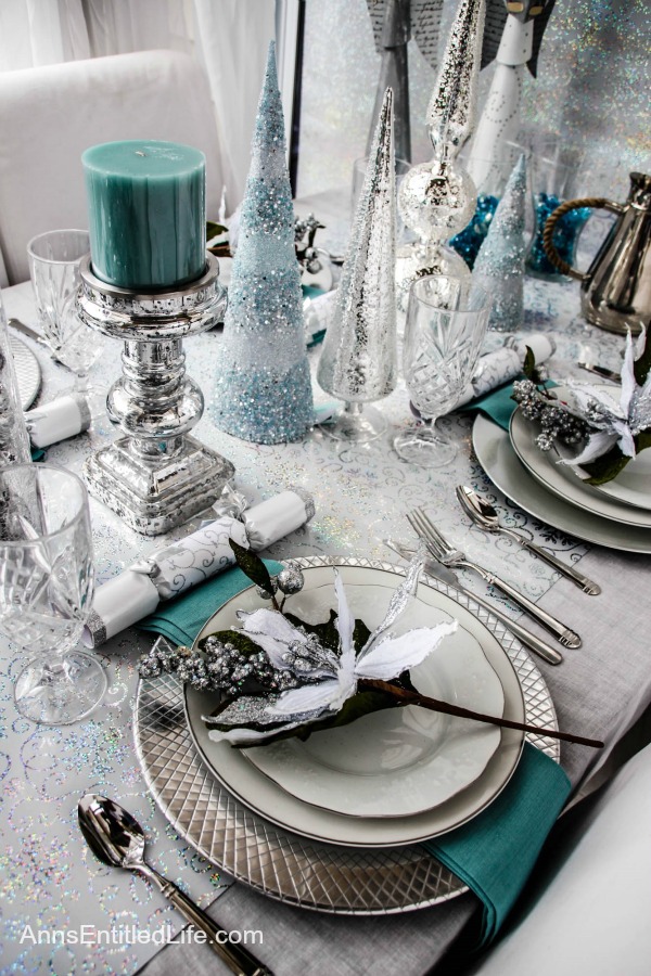 Winter Holiday Tablescape: White, Silver and Blue. Hosting a holiday party? Dressing up the table for Christmas, New Year's or just because? Break away from the traditional green and red Christmas colors and try something entirely different. This beautiful winter holiday tablescape features white, silver and blue. A lovely cool theme to compliment the winter landscape. 