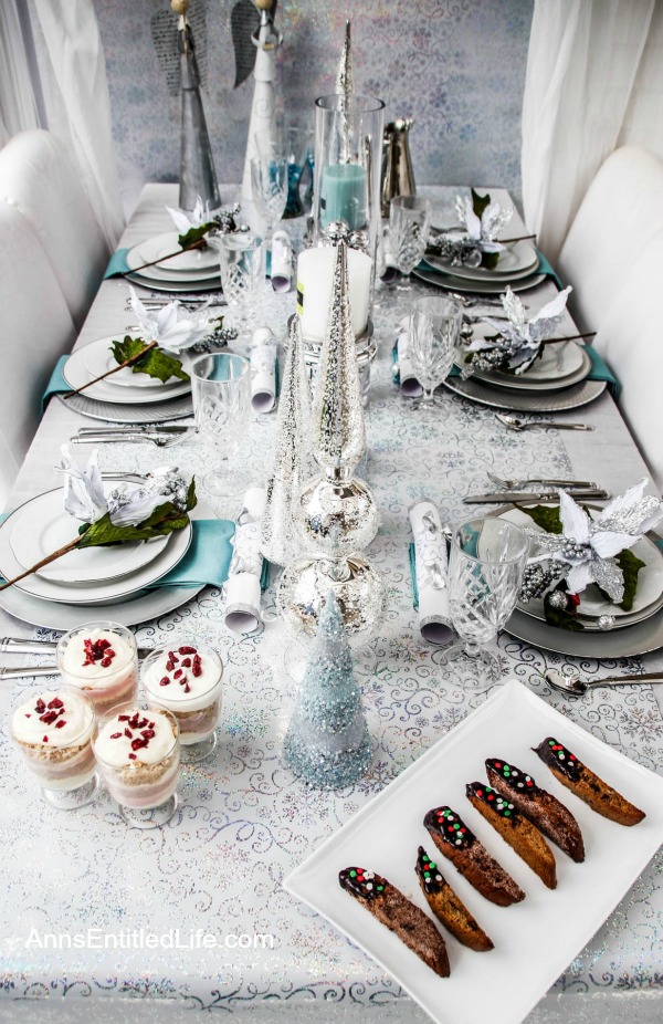 Winter Holiday Tablescape: White, Silver and Blue. Hosting a holiday party? Dressing up the table for Christmas, New Year's or just because? Break away from the traditional green and red Christmas colors and try something entirely different. This beautiful winter holiday tablescape features white, silver and blue. A lovely cool theme to compliment the winter landscape. 