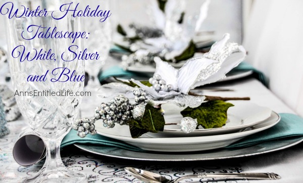 Winter Holiday Tablescape: White, Silver and Blue. Hosting a holiday party? Dressing up the table for Christmas, New Year's or just because? Break away from the traditional green and red Christmas colors and try something entirely different. This beautiful winter holiday tablescape features white, silver and blue. A lovely cool theme to compliment the winter landscape. 