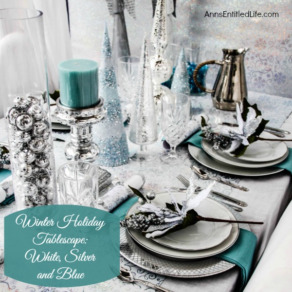 Winter Holiday Tablescape: White, Silver and Blue. Hosting a holiday party? Dressing up the table for Christmas, New Year's or just because? Break away from the traditional green and red Christmas colors and try something entirely different. This beautiful winter holiday tablescape features white, silver and blue. A lovely cool theme to compliment the winter landscape. 