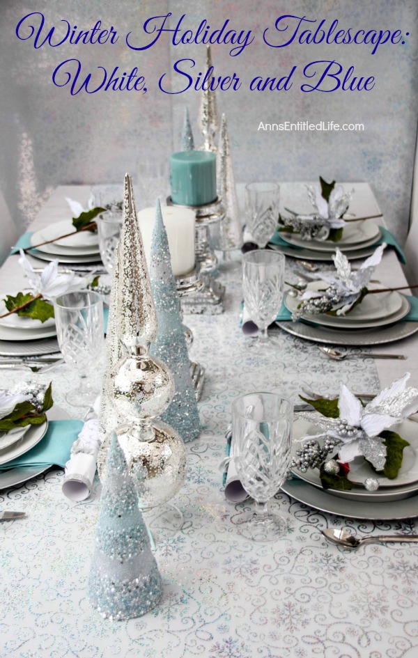 Winter Holiday Tablescape: White, Silver and Blue. Hosting a holiday party? Dressing up the table for Christmas, New Year's or just because? Break away from the traditional green and red Christmas colors and try something entirely different. This beautiful winter holiday tablescape features white, silver and blue. A lovely cool theme to compliment the winter landscape. 