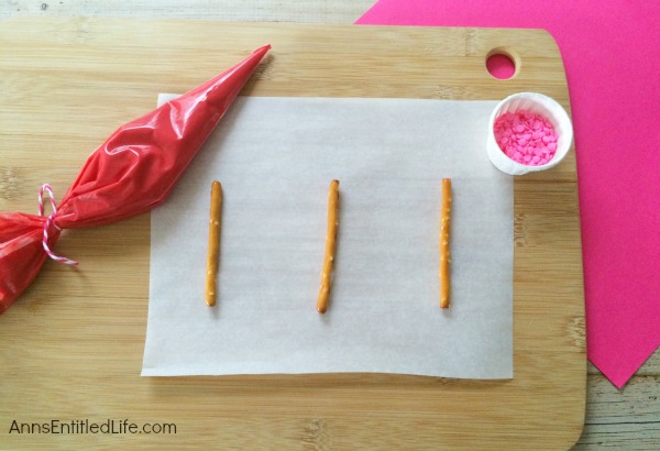 Easy Heart Pretzel Recipe. These 3 ingredient, adorable Heart Pretzels are easy to make! Wrap them up for school treats, or serve to friends and family as a special snack! Everyone will love these Easy Heart Pretzels.