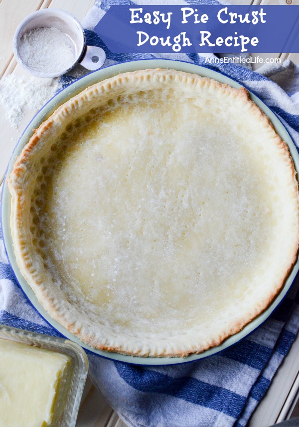 pie shell in pan on blue and white dishcloth