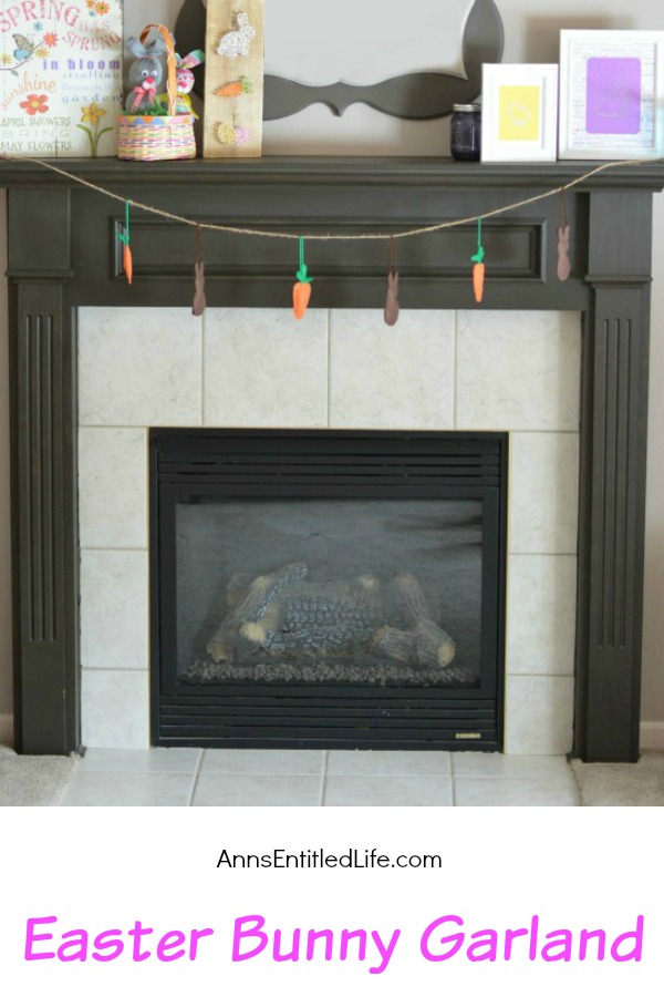 a garland made of stuffed bunnies and carrots hanging by a fireplace