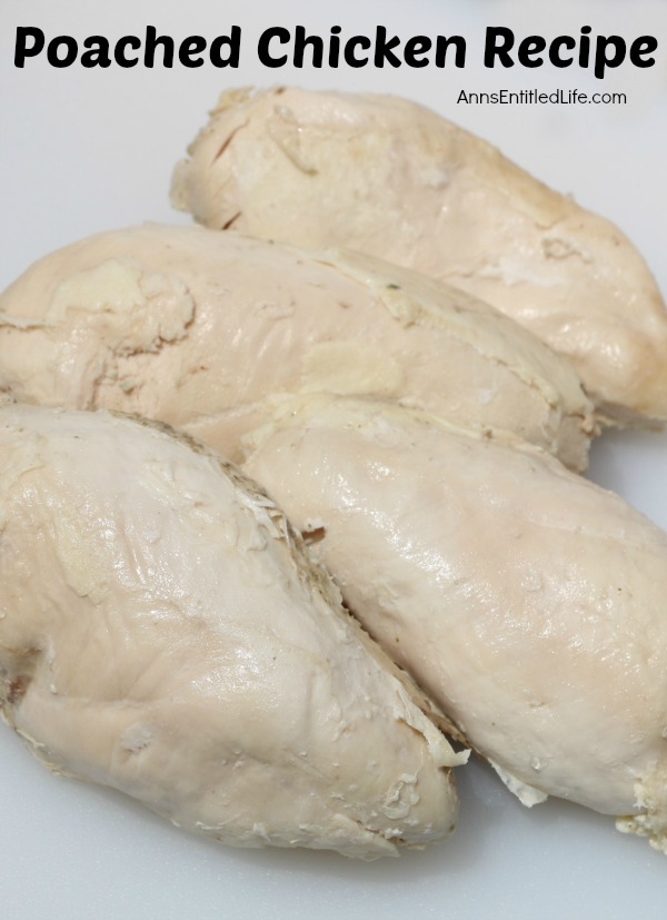 4 pieces of poached chicken sitting on a white cutting board