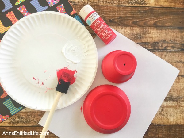 DIY Terra Cotta Garden Mushrooms. Make your own cute garden decor simply and inexpensively! Here's an easy step by step tutorial on how to make these DIY Terra Cotta Garden Mushrooms to brighten up and add a touch of whimsy your gardens.