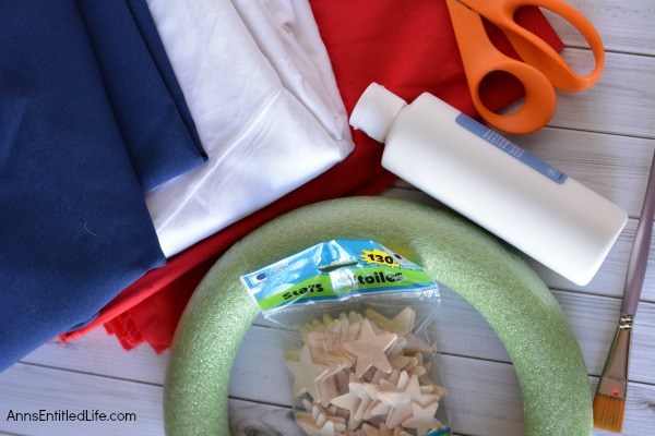 Easy DIY Flag Wreath. Make your own no-sew Flag Wreath using these easy step by step instructions. This cute patriotic decor is perfect for Memorial Day, Independence Day, or any day! Simple and inexpensive to make, this Easy DIY Flag Wreath will add a marvelous touch of whimsy to your holiday decor.