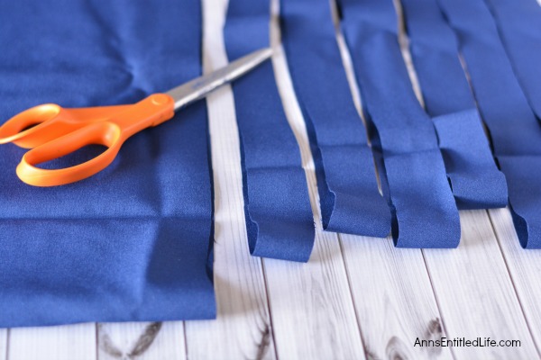 Easy DIY Flag Wreath. Make your own no-sew Flag Wreath using these easy step by step instructions. This cute patriotic decor is perfect for Memorial Day, Independence Day, or any day! Simple and inexpensive to make, this Easy DIY Flag Wreath will add a marvelous touch of whimsy to your holiday decor.