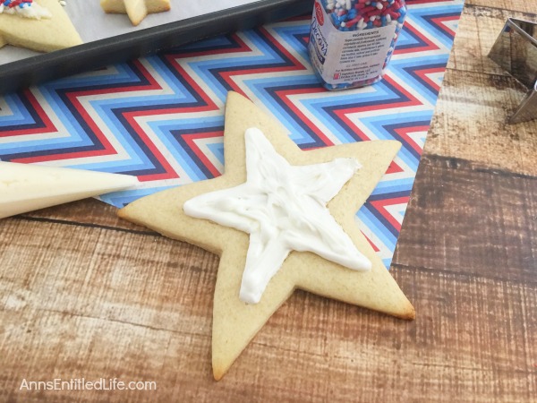 Homemade Star Cookies Recipe. A fun and festive star cookie treat, perfect for summer picnics, Independence Day celebrations and more! This delicious vanilla dough and accompanying vanilla frosting recipe will have your friends and family gobbling up these tasty Homemade Star Cookies!