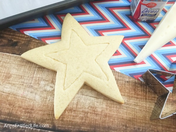 Homemade Star Cookies Recipe. A fun and festive star cookie treat, perfect for summer picnics, Independence Day celebrations and more! This delicious vanilla dough and accompanying vanilla frosting recipe will have your friends and family gobbling up these tasty Homemade Star Cookies!