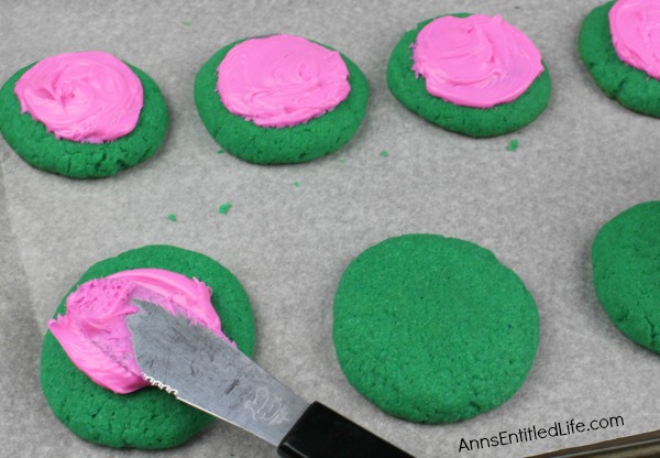 Watermelon Cookies Recipe. These adorable Watermelon cookies are so simple to make! Use a cake mix to make these delicious cookies that taste look and taste like a watermelon. These are a fun time summer cookie that your children, family and friends will love.