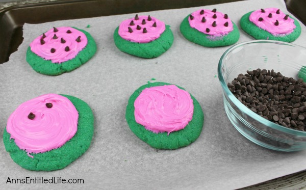 Watermelon Cookies Recipe. These adorable Watermelon cookies are so simple to make! Use a cake mix to make these delicious cookies that taste look and taste like a watermelon. These are a fun time summer cookie that your children, family and friends will love.