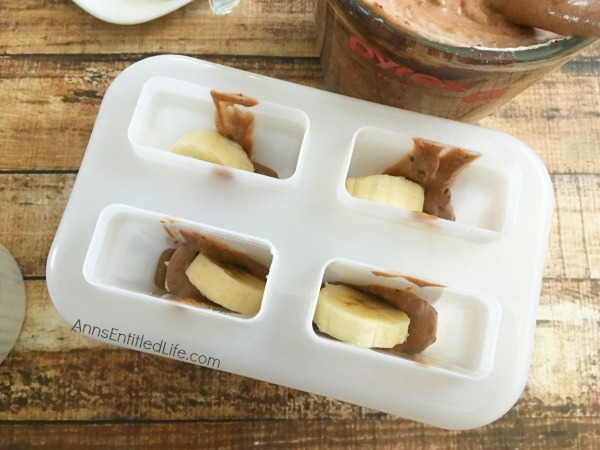 Chocolate Banana Pudding Pops Recipe. These frozen chocolate banana pudding pops are a delicious, luscious, simply fabulous treats on a hot summer day. Easy to make, these wonderful frozen refreshments will hit the right cool spot as an afternoon snack, dessert or outside sweet after backyard play.