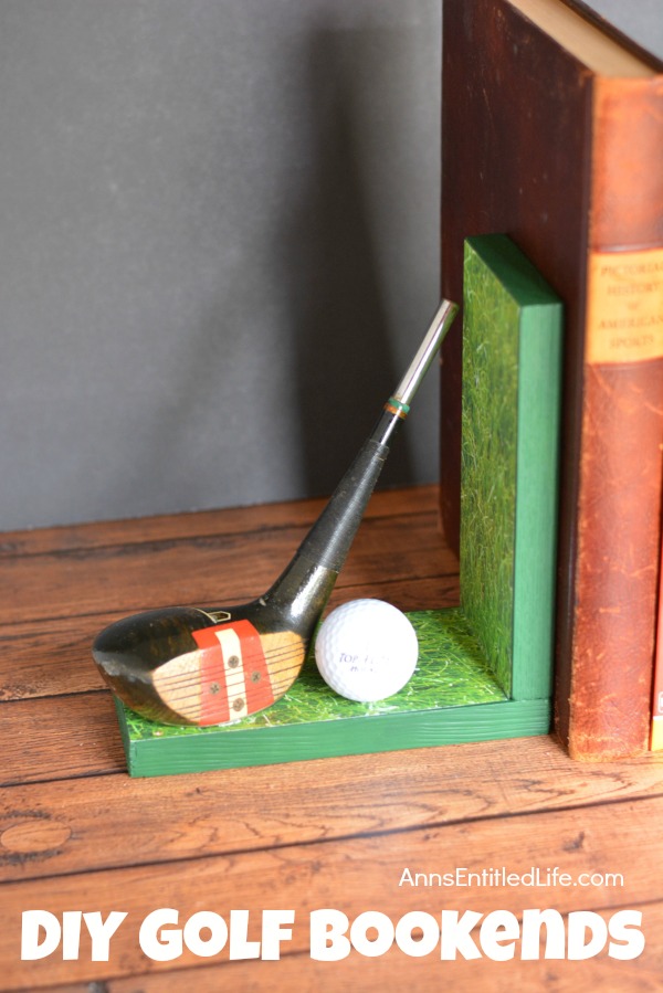 Left side of handmade bookends with golf club decor. There are several books in between the book ends. This is set upon a mantel, against a grey wall background.