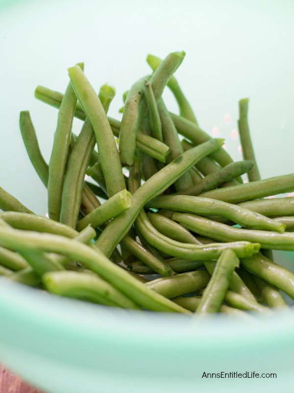 Canned Green Beans Recipe. A super easy home canning recipe with step by step tutorial photographs on how to can green beans. In under an hour you can preserve your harvest of green beans to enjoy year-round.