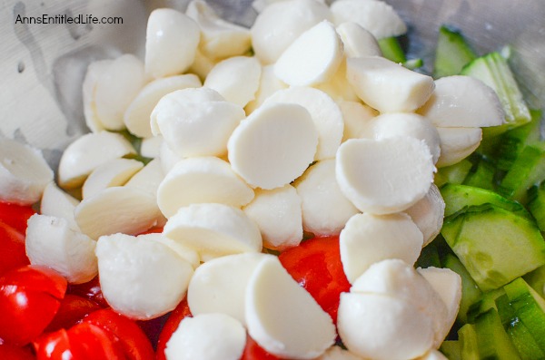 Cucumber Caprese Salad Recipe. A beautiful and delicious take on a traditional Caprese Salad, this Cucumber Caprese Salad Recipe is a perfect side dish with steak, burgers, turkey legs, barbecue chicken and more! Easy to make, this Cucumber Caprese Salad recipe is loaded with sweet, fresh vegetables. Try it today!