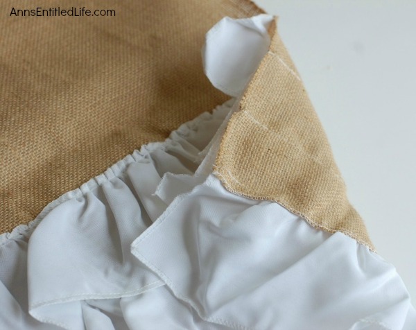 DIY Easy No Sew Throw Pillow. Make this easy, no sew throw pillow for a quick decor update. This step by step tutorial will teach you how to make this no sew ruffle burlap pillow in a short time. Simple to make, this ruffled burlap pillow is adorable for bed decor, family room decor or even casual living room decor!