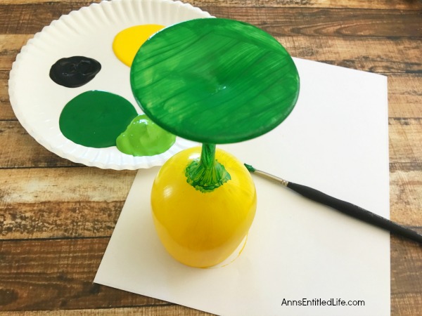 DIY Pineapple Candle Holder. Make your own adorable DIY Pineapple Candle Holder. This step by step tutorial will show you how to easily make pineapples from a wine glass! This is perfect for a centerpiece, mantel decor or table decorations throughout the year. Pineapple symbolized hospitality, so make a few and give them as a housewarming gift, bridal shower or birthday present, or just because! If you are looking for a cute craft project, this is it!