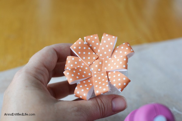 Paper Pumpkin Craft. This sweet little Paper Pumpkin Craft is perfect for autumn decor! Make one, make three, make a dozen; the more the merrier and they are easy to fabricate. Whether looking for mantel or tablescape decorations or just a whimsical adornment for a side table or windowsill, this simple to make Paper Pumpkin Craft is a great addition to your fall decorating scheme.