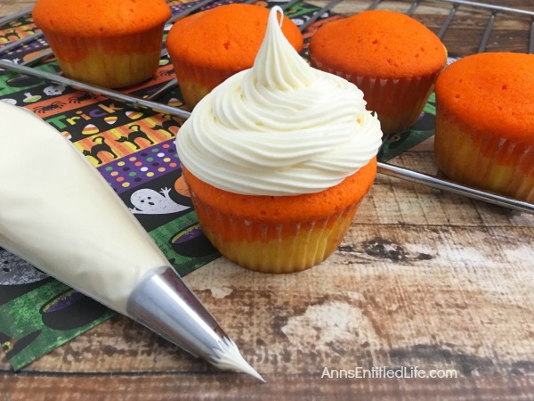 Candy Corn Cupcakes Recipe. A fall favorite, these delicious, easy to make sweet cupcake treats are perfect for snack-time, lunch-time, anytime! Get into the spirit of Autumn with these adorable Candy Corn Cupcakes.