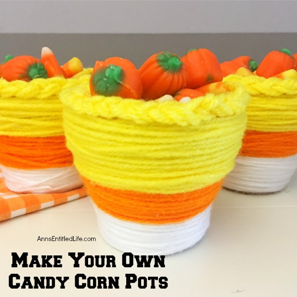 DIY Candy Corn Pots. These DIY Candy Corn Pots are simple to make. Dress up your pots for autumn or Halloween with this sweet candy corn decoration. Perfect for planting herbs in the fall for your kitchen window, or to hold candy corn candy, Halloween treats or nuts on a sideboard, mantel or end table, these do it yourself candy corn posts are a nice touch of whimsical fall décor.