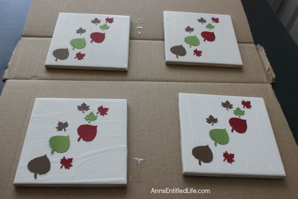 Easy DIY Autumn Coasters. These DIY Autumn coasters are simple to make. Instead of resin, they use a spray to form a heat resistant coating (to 500 degrees!) which seals and protects. Add a touch of fall decor to your living area with these easy to make autumn coasters.