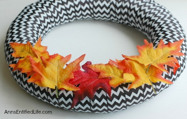 BOO-Tiful Halloween Wreath. While this beautiful DIY Halloween Wreath will not scare anyone, it is lovely and stylish Halloween decor. Hang this Halloween wreath on your front door, side door, over a mantel - anywhere you place seasonal wreath decor. These easy to follow step by step instruction tutorial will have you completing this BOO-Tiful Halloween Wreath in no time flat!